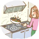 キッチンで料理している女性