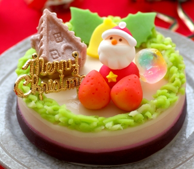 京都よし廣の和菓子のクリスマスケーキ。サンタがプレゼントを担ぐ