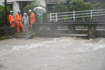 九州豪雨で増水した鹿児島市の和田川(共同通信社)